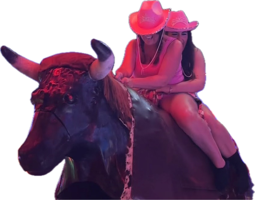 Guests enjoying the mechanical bull at an After Dark event